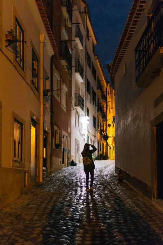 woman standing in alley
